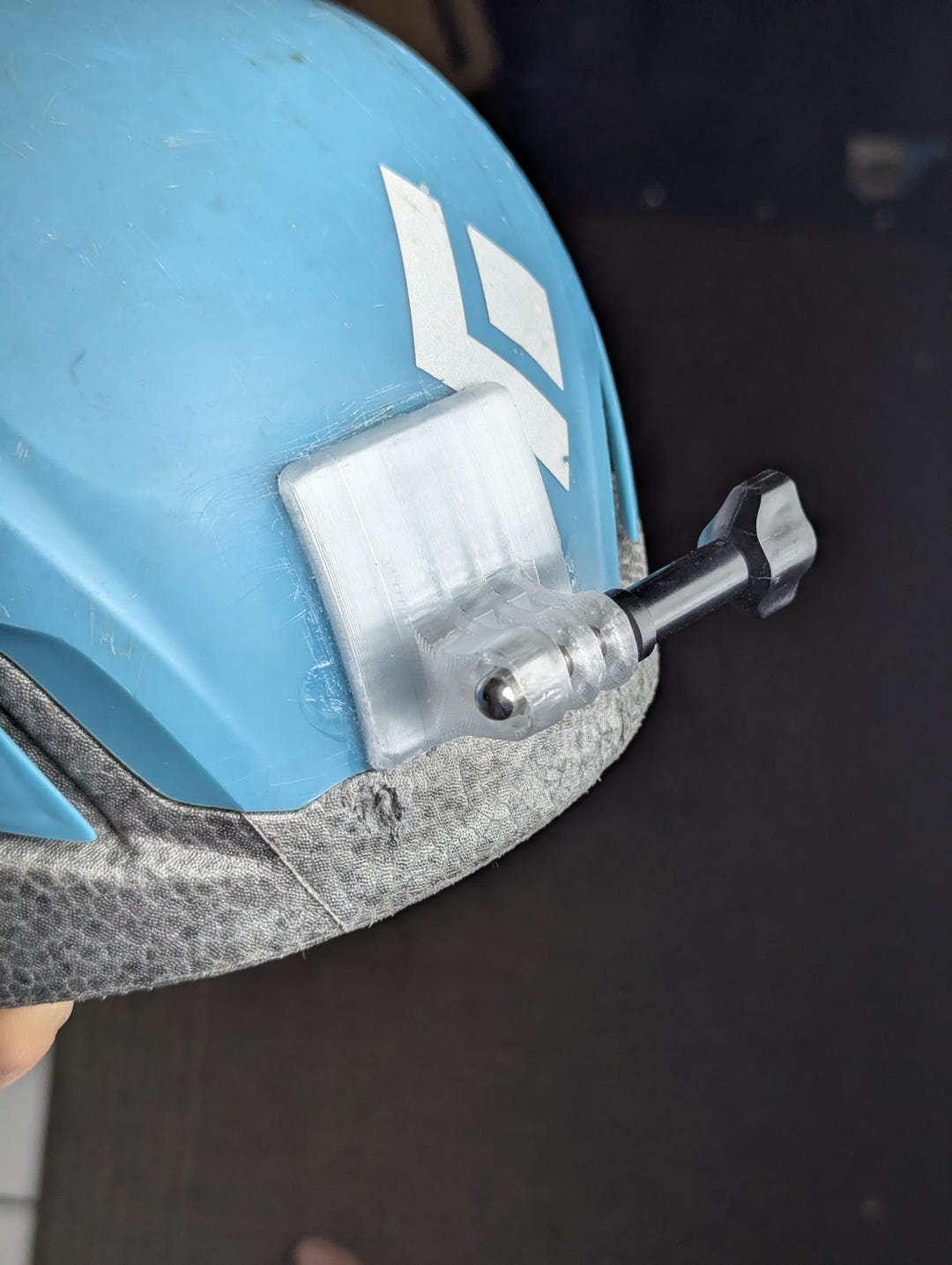 Curved action camera helmet mount